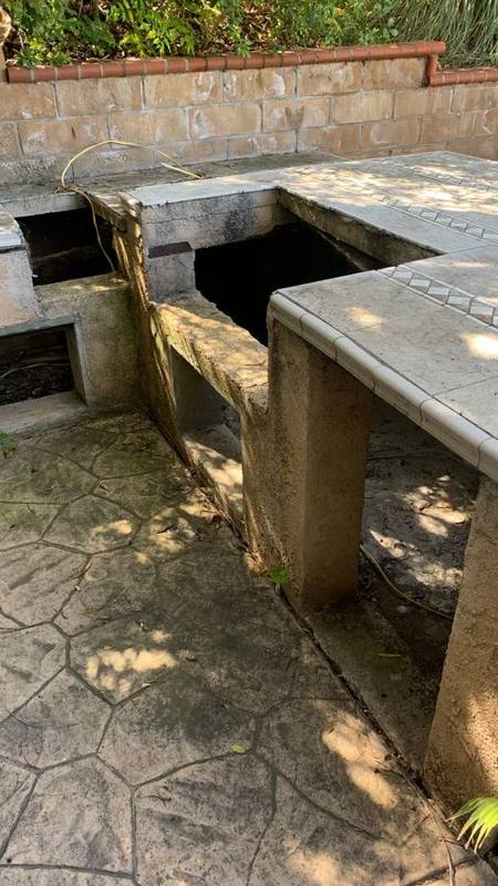 Outdoor BBQ area with grime