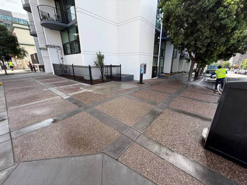 Pressure washing a building entrance