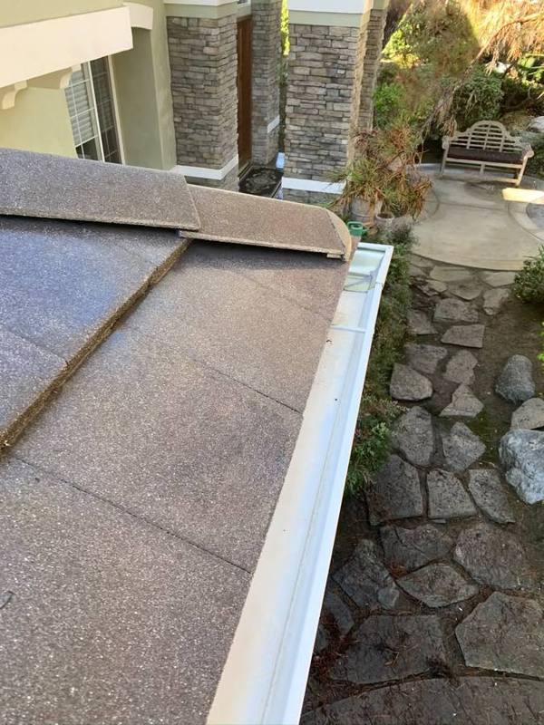 Clean gutter along a tile roof