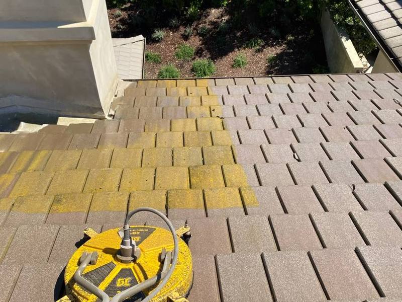 Surface cleaner on a roof, half cleaned